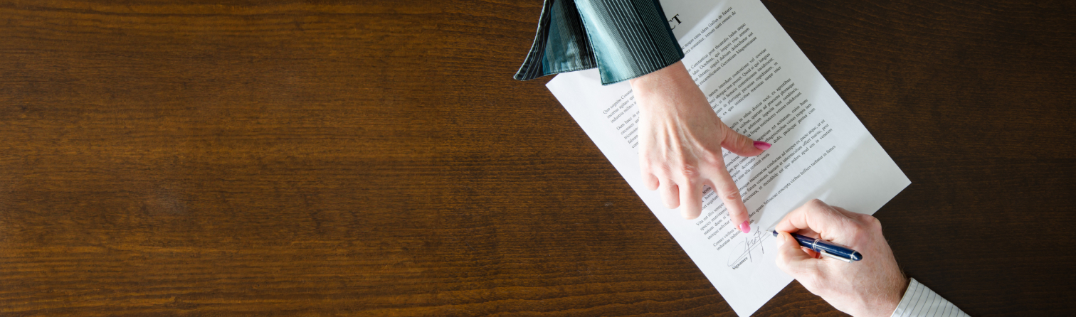 Business people signing contract