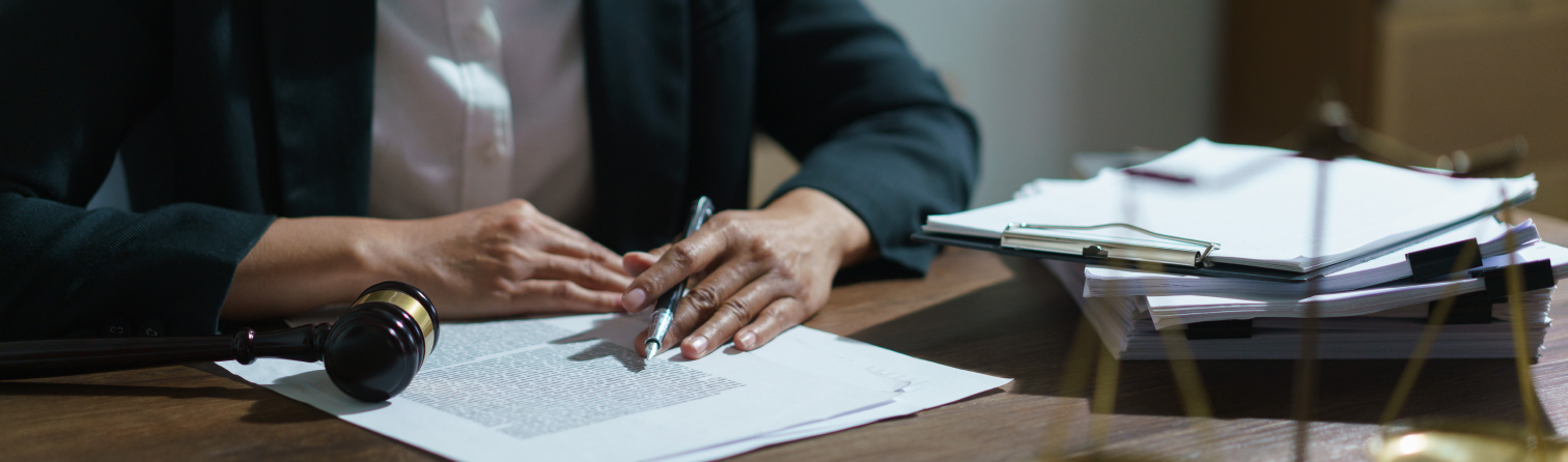Businesswoman lawyer reading agreement business to signing on contract and working in legal office