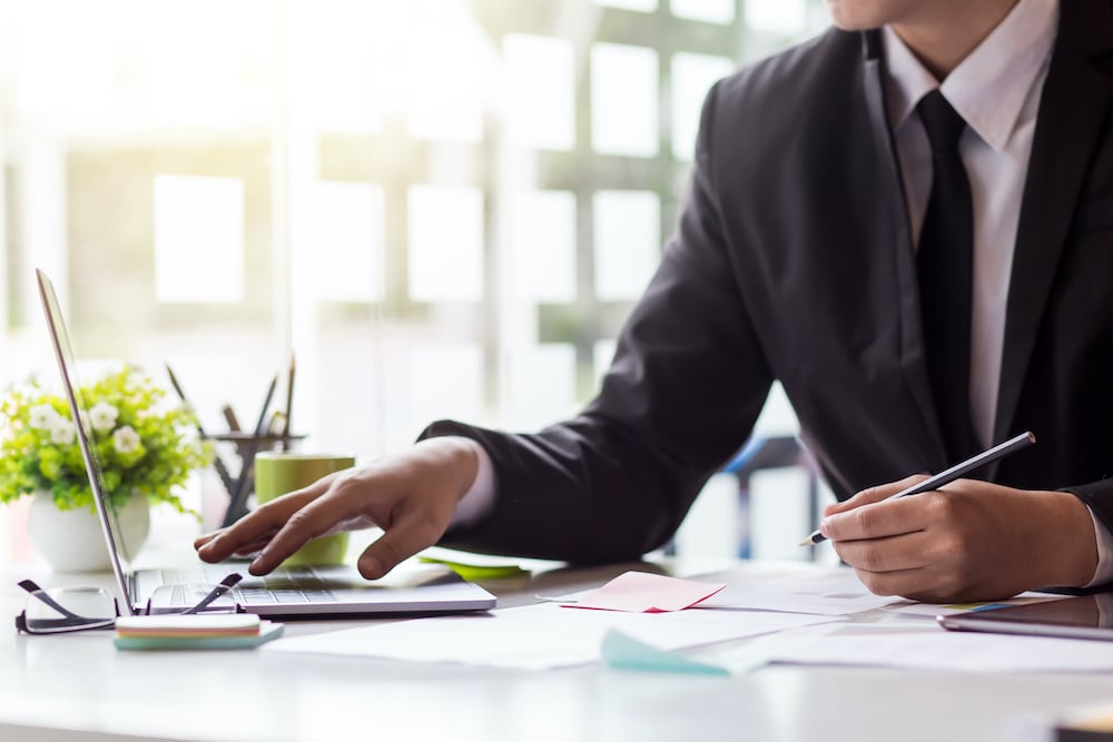 businessman looking at a computer